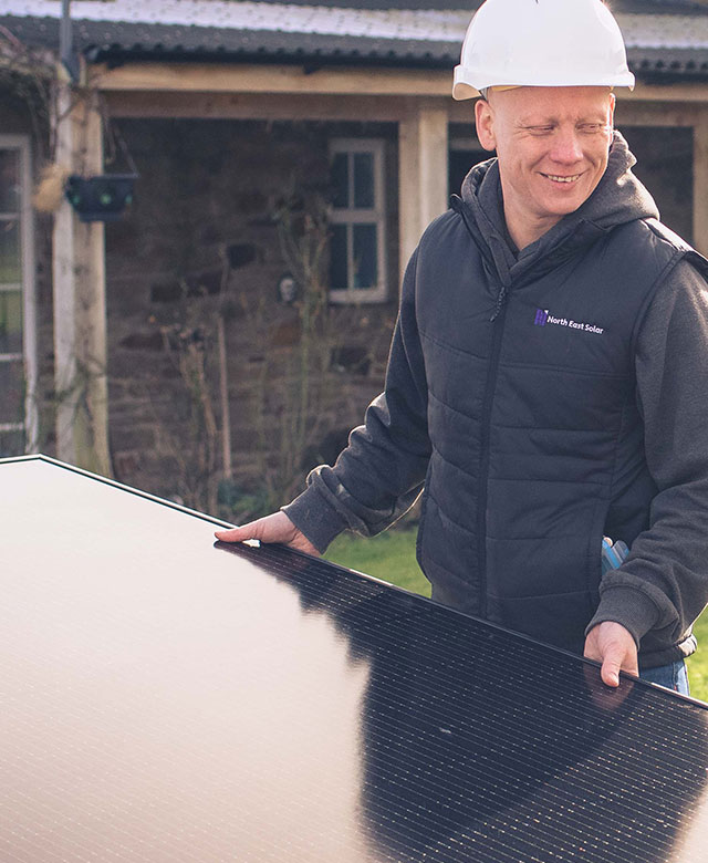 north east solar employees putting solar panels on a domestic house