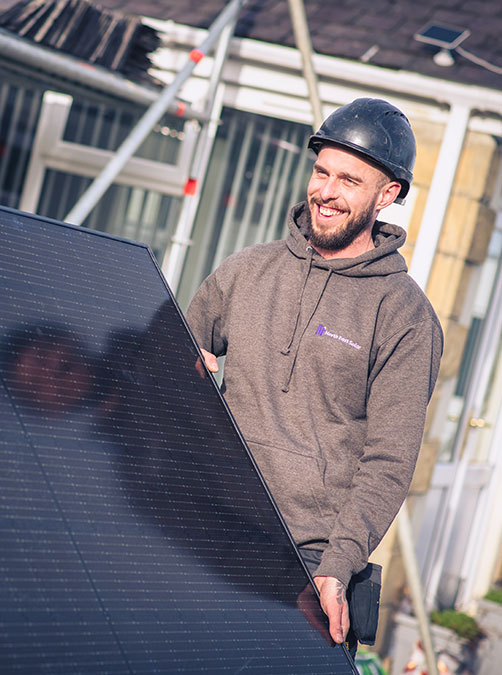 north east solar employees putting solar panels on a domestic house